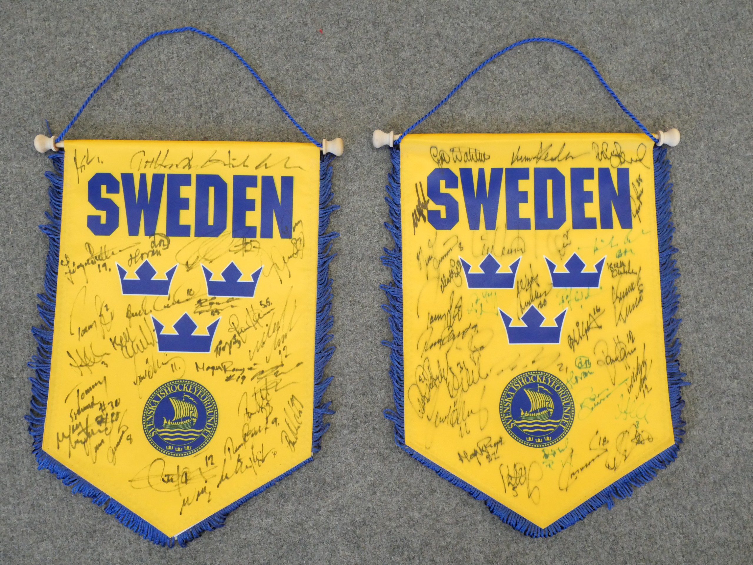 Tre Kronor viirit nimikirjoituksilla