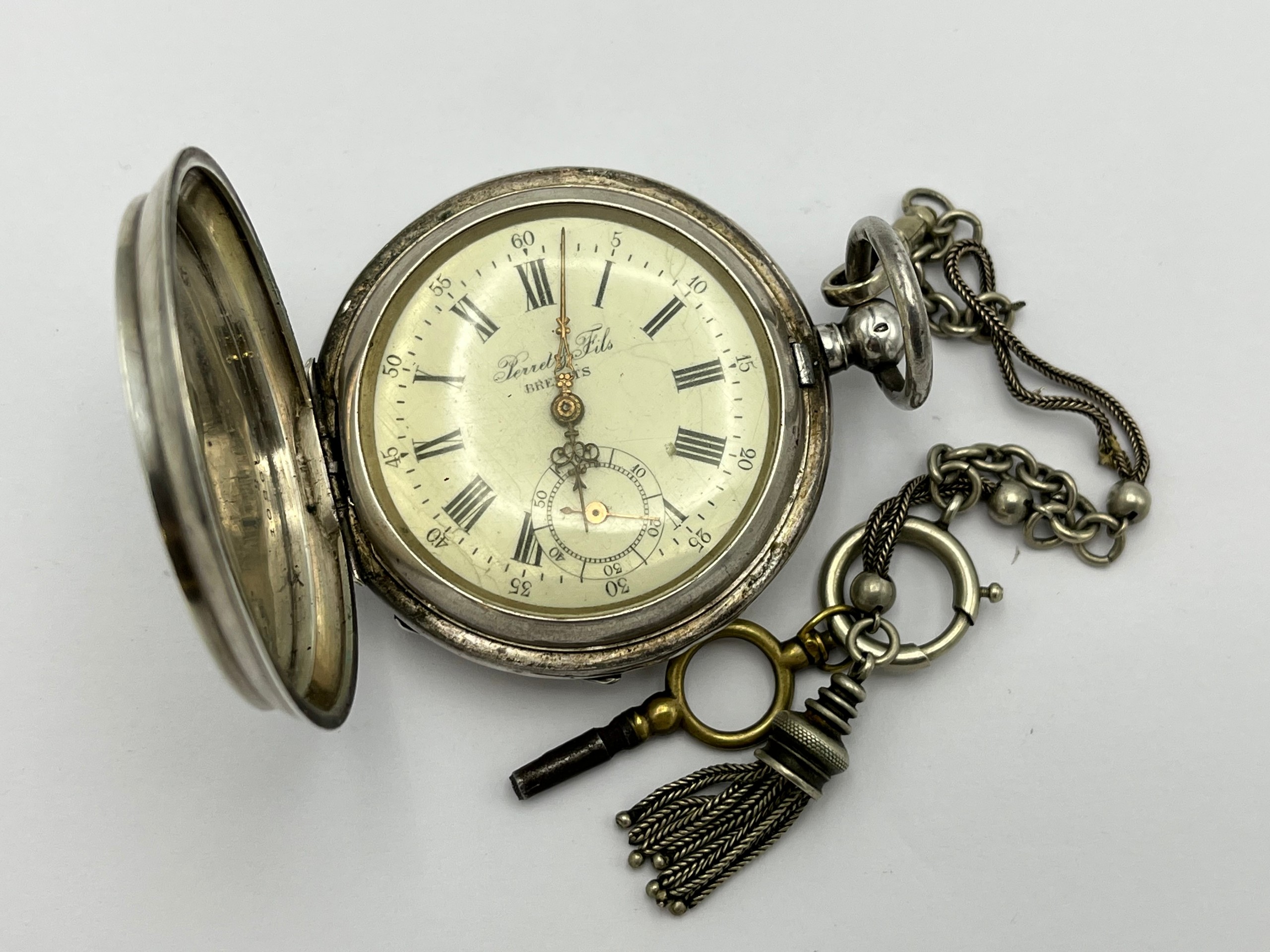 Hopeakuorinen taskukello - Huutokauppa Ekman