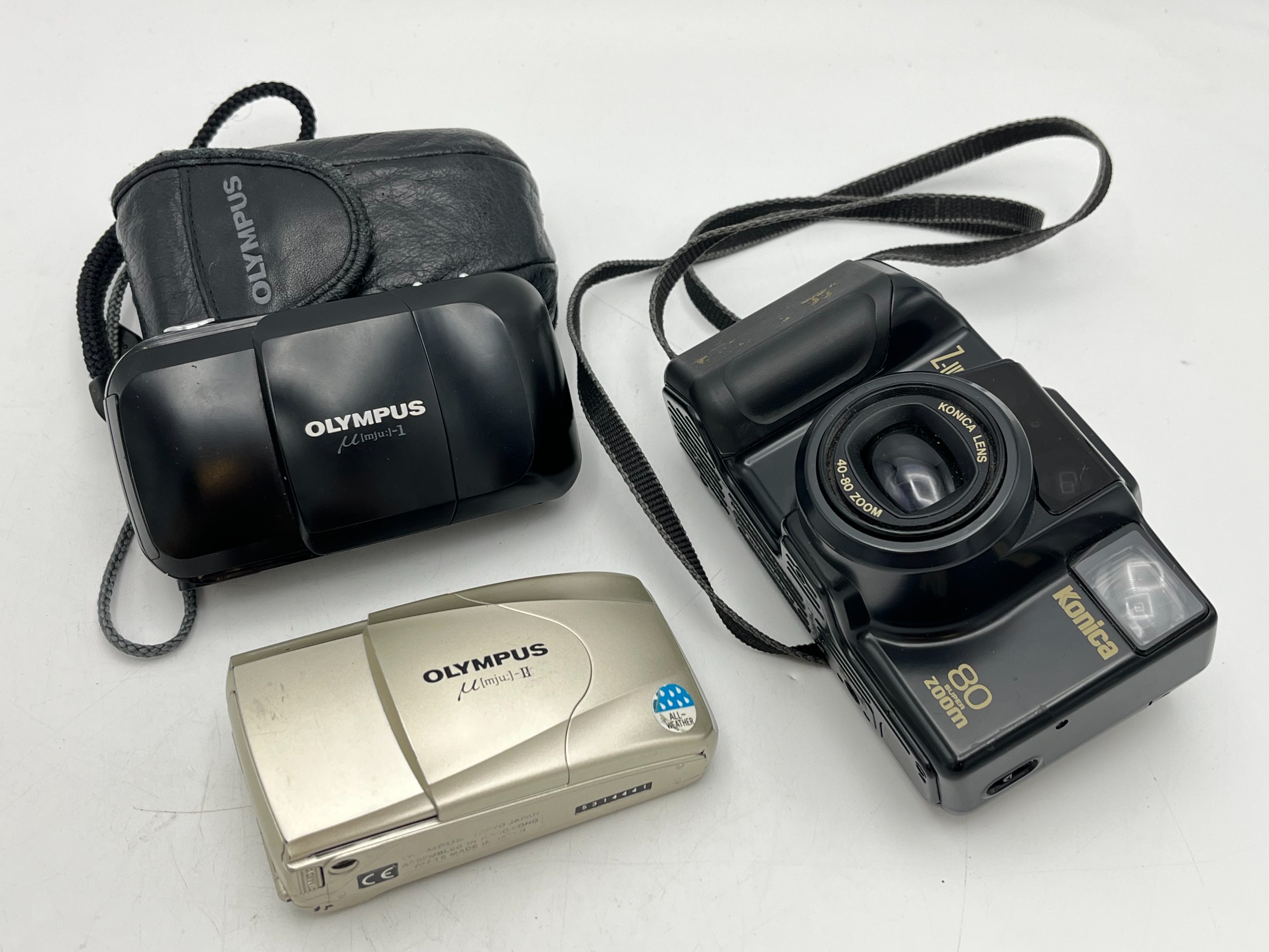 Olympus, Konica - Huutokauppa Ekman