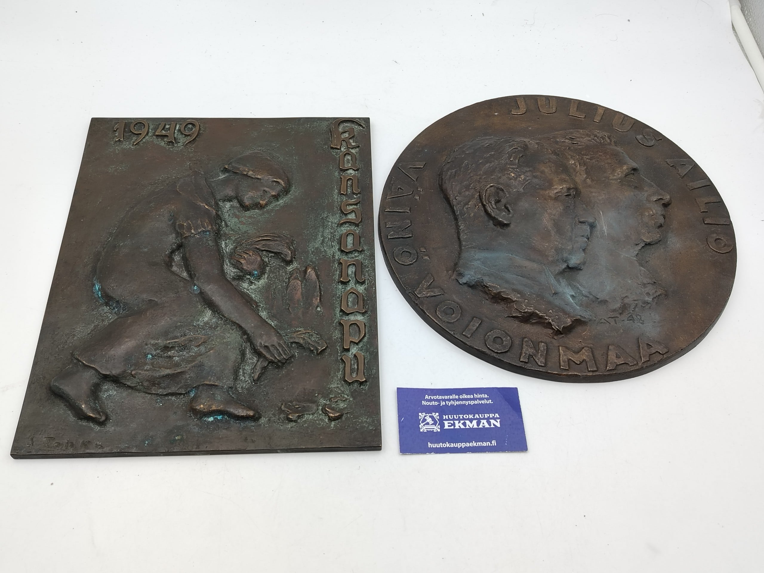 Metallireliefi - Huutokauppa Ekman
